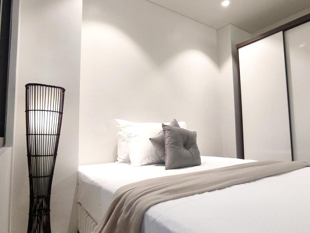 Postel nebo postele na pokoji v ubytování ReLuxe マリン Condo