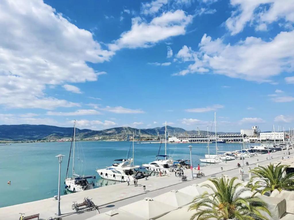 a marina with boats parked in the water at Marine Apartment with sea & port view! in Volos