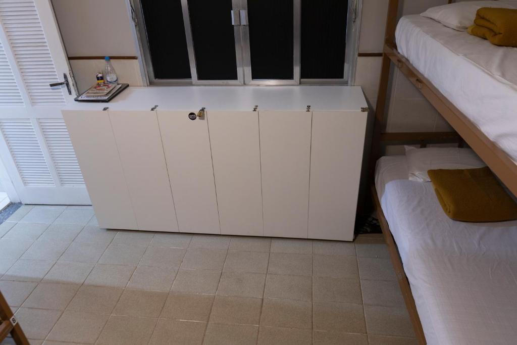 Postel nebo postele na pokoji v ubytování Hostel Diniz