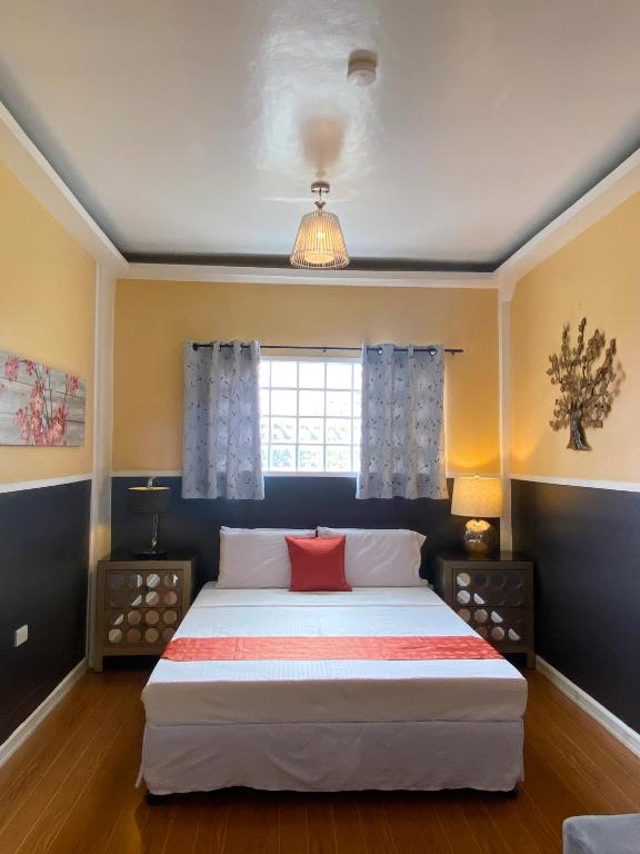 Postel nebo postele na pokoji v ubytování Little Norway Guesthouse - Mactan Cebu International Airport