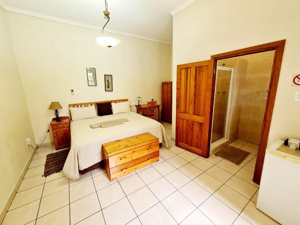 Postel nebo postele na pokoji v ubytování Resthaven Guesthouse