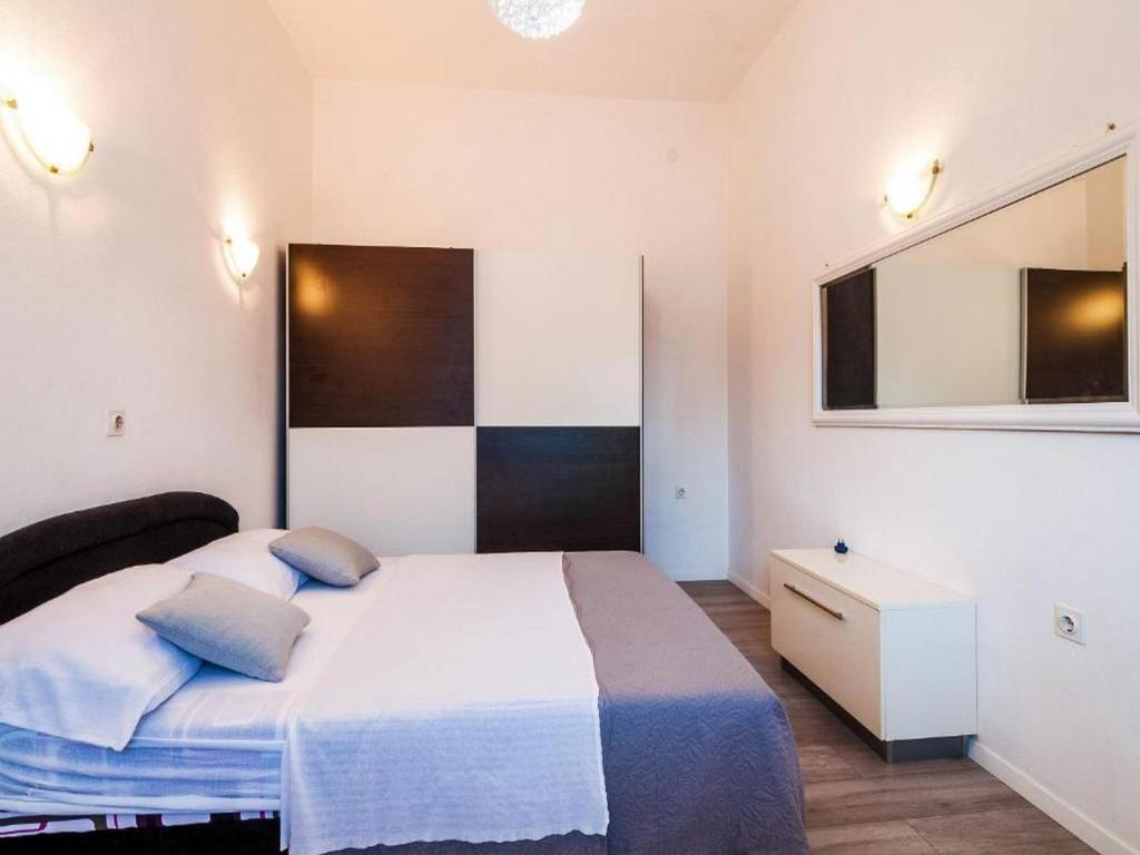 Posteľ alebo postele v izbe v ubytovaní Angelo's Apartments