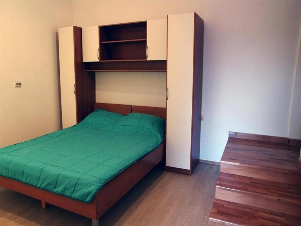 Posteľ alebo postele v izbe v ubytovaní Angelo's Apartments