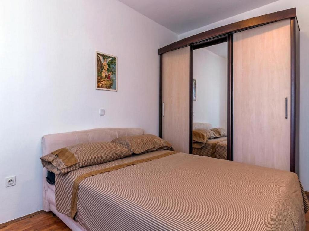 Posteľ alebo postele v izbe v ubytovaní Angelo's Apartments