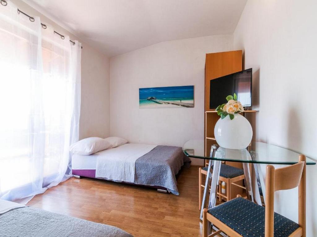 Posteľ alebo postele v izbe v ubytovaní Angelo's Apartments