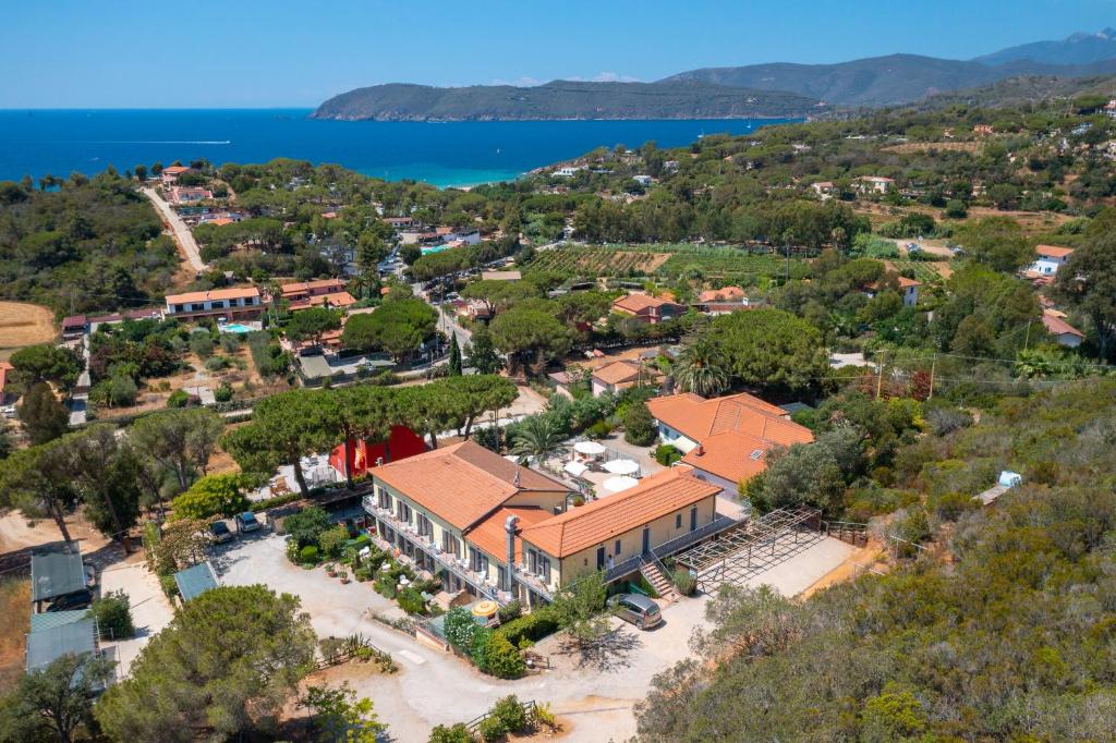 an aerial view of a house with a lake at Hotel Villa Wanda in Porto Azzurro