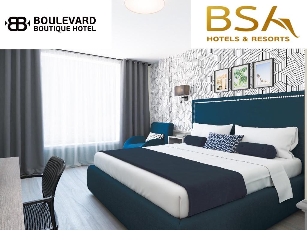 a bedroom with a large bed and aavid furniture hotel at BSA Boulevard Boutique in Sunny Beach