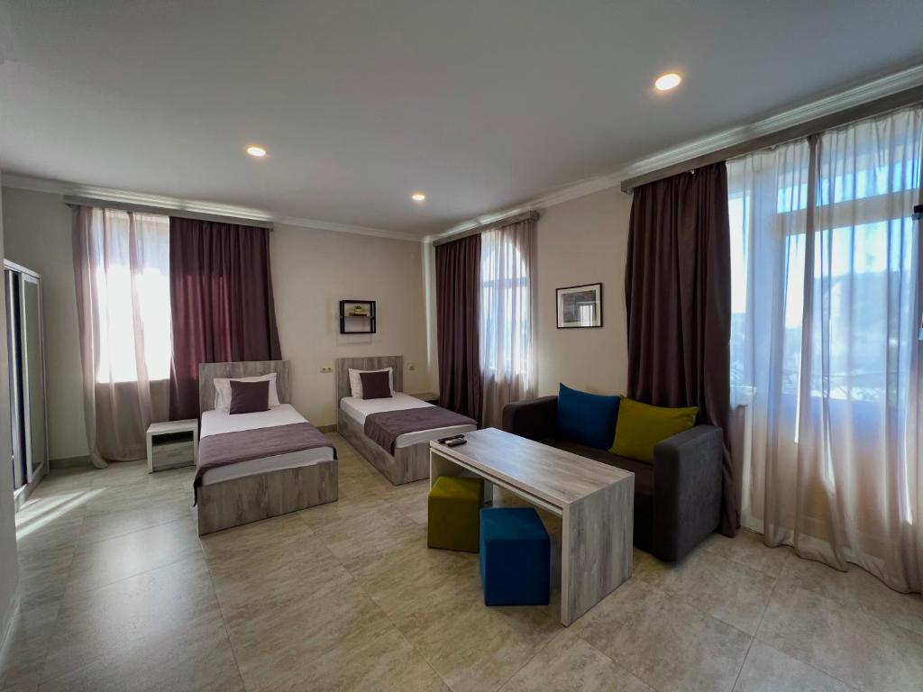 Postel nebo postele na pokoji v ubytování Hotel Menua