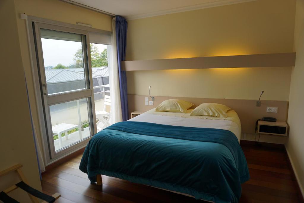 Postel nebo postele na pokoji v ubytování Hotel Ker Vennaik