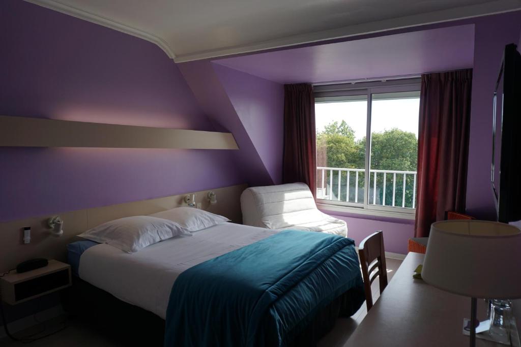 Postel nebo postele na pokoji v ubytování Hotel Ker Vennaik