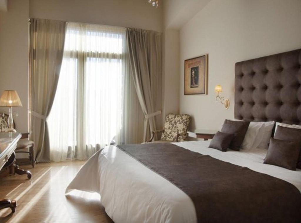 Postel nebo postele na pokoji v ubytování Tagli Resort & Villas