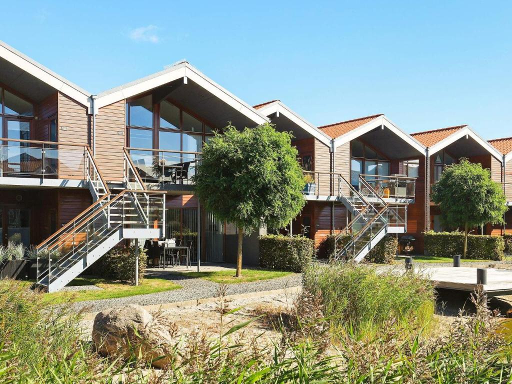 un edificio con escaleras delante en 4 person holiday home in Bogense, en Bogense