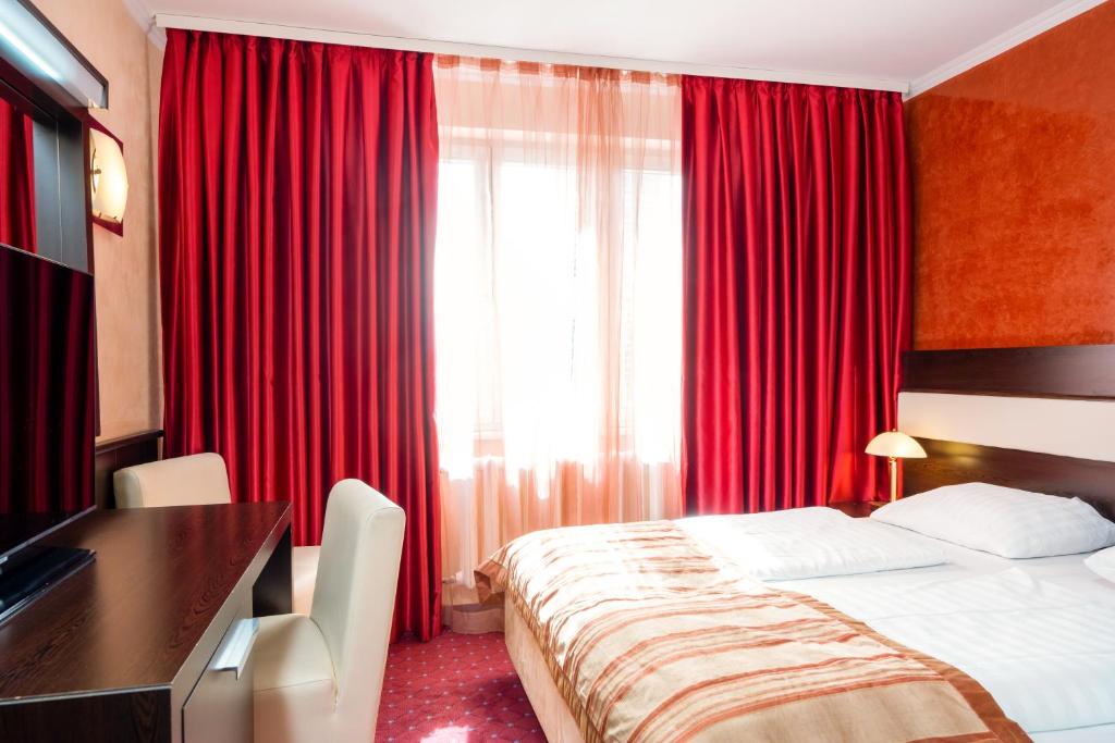Postel nebo postele na pokoji v ubytování Hotel Klassik Berlin