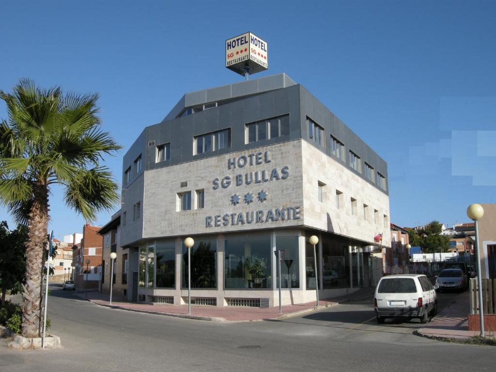 a building with a sign on the top of it at Hotel SG in Bullas