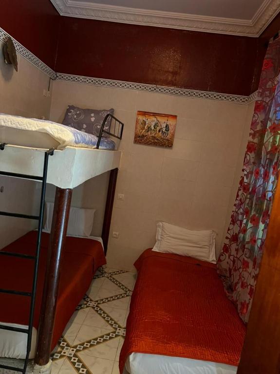 Postel nebo postele na pokoji v ubytování Riad Elijah Marrakech & Spa
