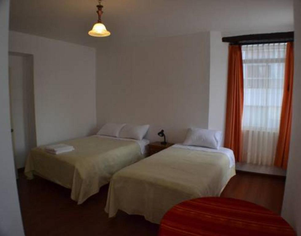 Postel nebo postele na pokoji v ubytování Heritage Inn