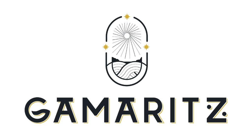 a label for a gamefair with a mouth with a ball and stars at Le Gamaritz in Biarritz