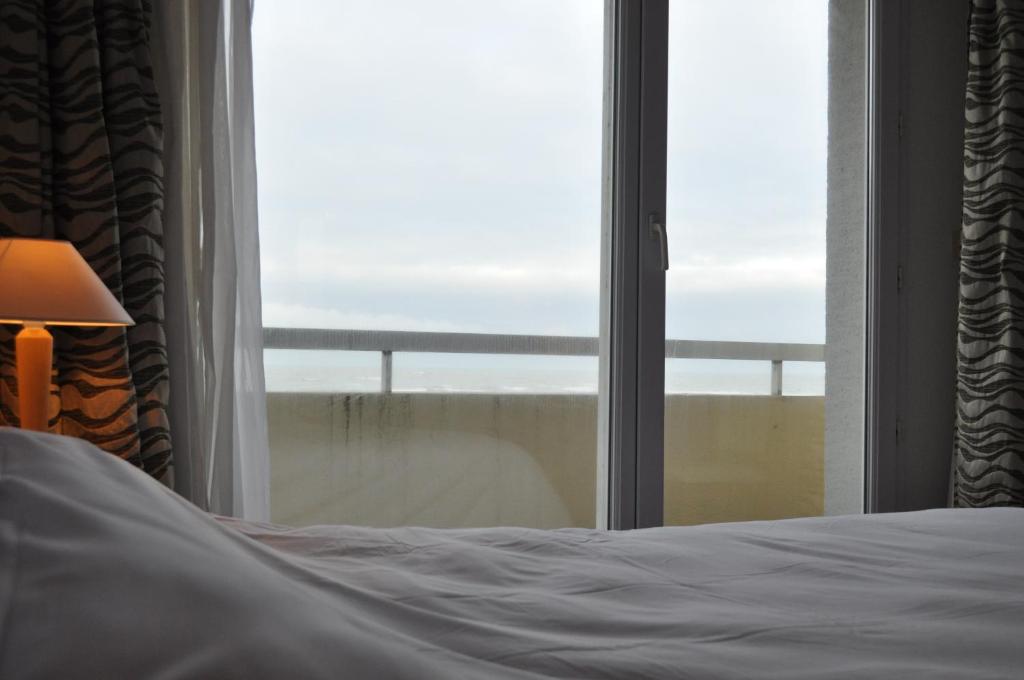 Кровать или кровати в номере Hotel La Terrasse