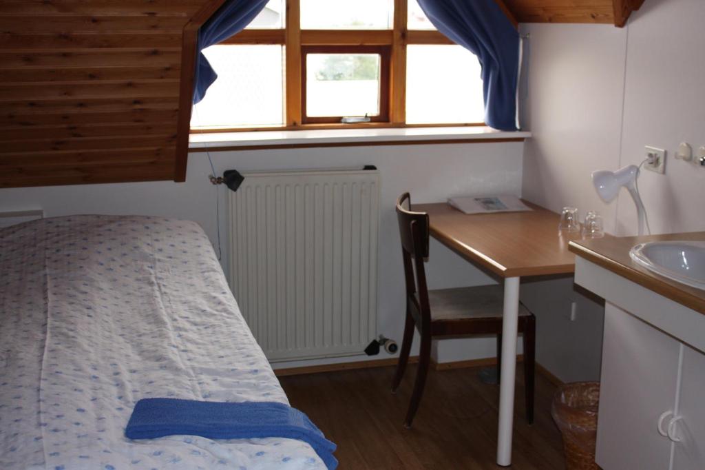 Postel nebo postele na pokoji v ubytování Skútustadir Guesthouse