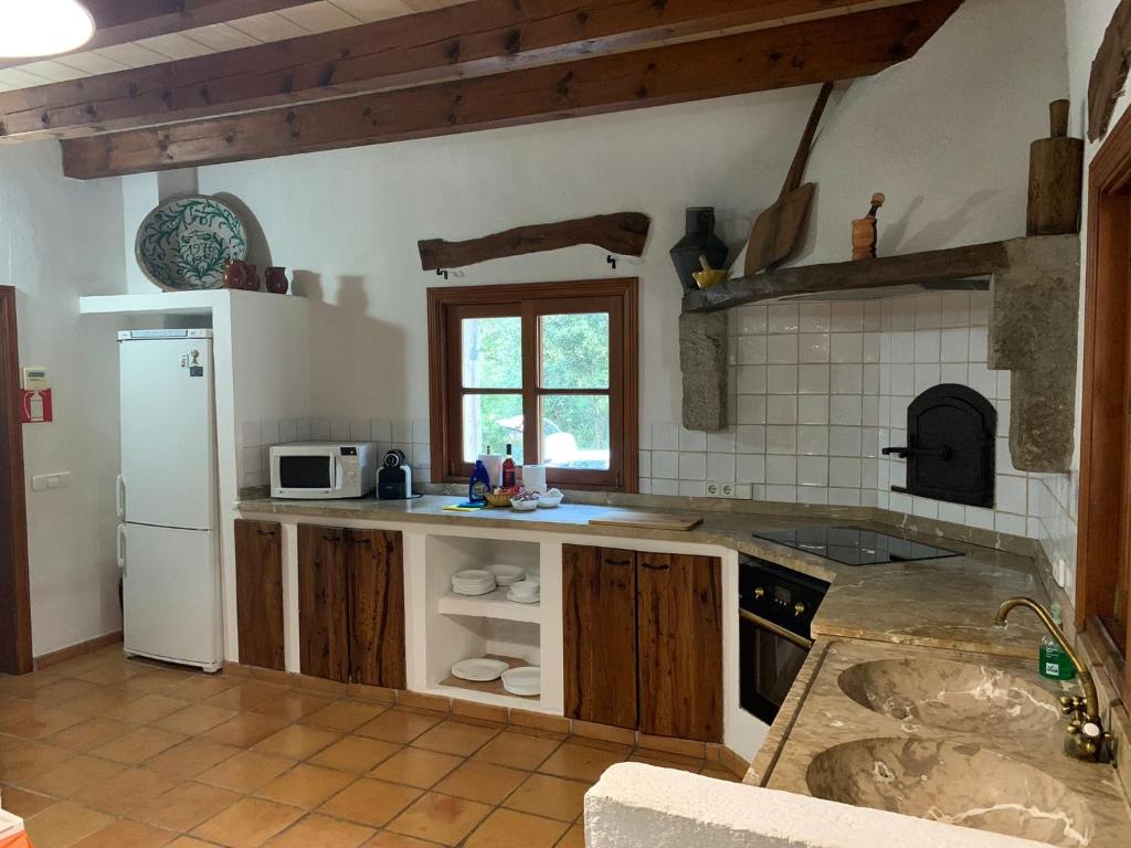Kuchyň nebo kuchyňský kout v ubytování Villa Can Tolo