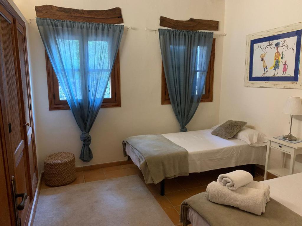 Postel nebo postele na pokoji v ubytování Villa Can Tolo