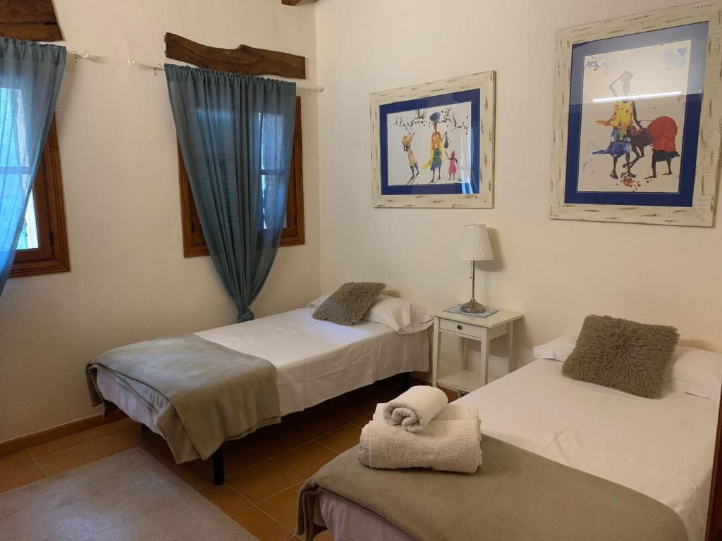 Postel nebo postele na pokoji v ubytování Villa Can Tolo