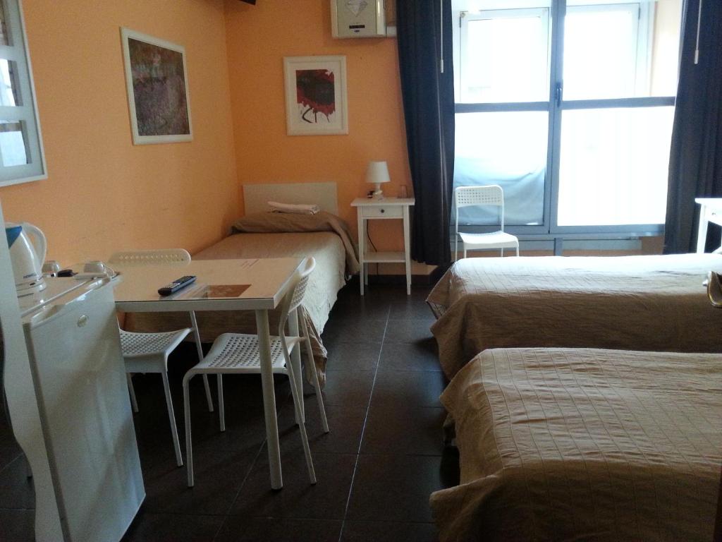 Postel nebo postele na pokoji v ubytování Affittacamere Andronaco