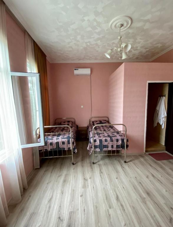 Postel nebo postele na pokoji v ubytování Guest House Sveta