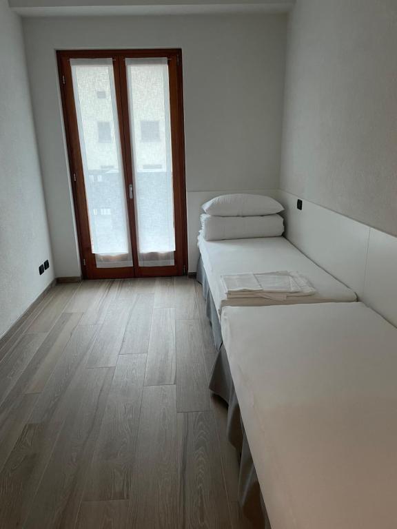 Łóżko lub łóżka w pokoju w obiekcie Appartamenti Sky Express