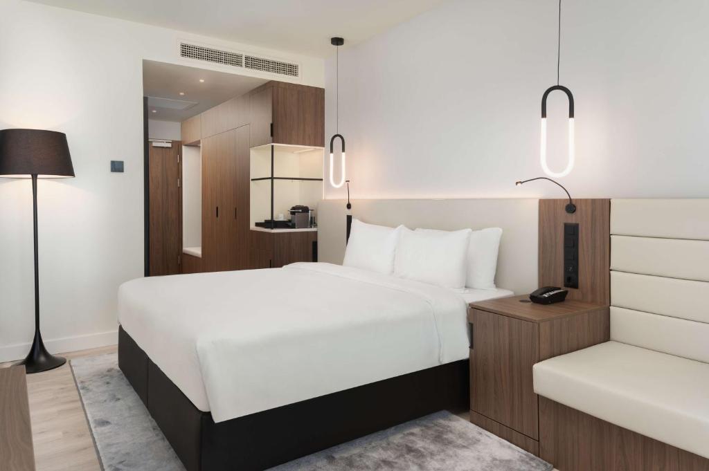 Postel nebo postele na pokoji v ubytování Radisson Blu Hotel, Cluj