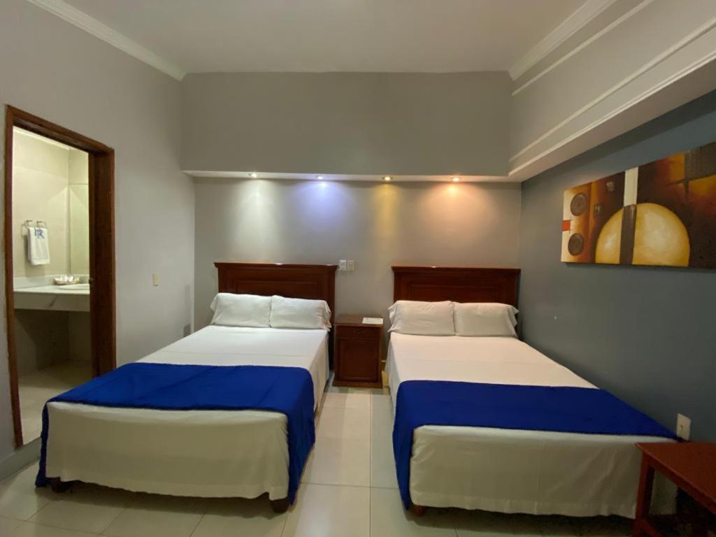 Postel nebo postele na pokoji v ubytování Hotel Real de La Barca