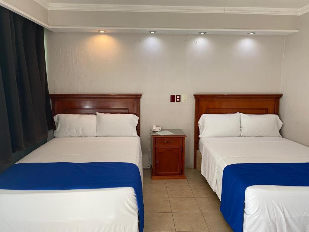 Postel nebo postele na pokoji v ubytování Hotel Real de La Barca