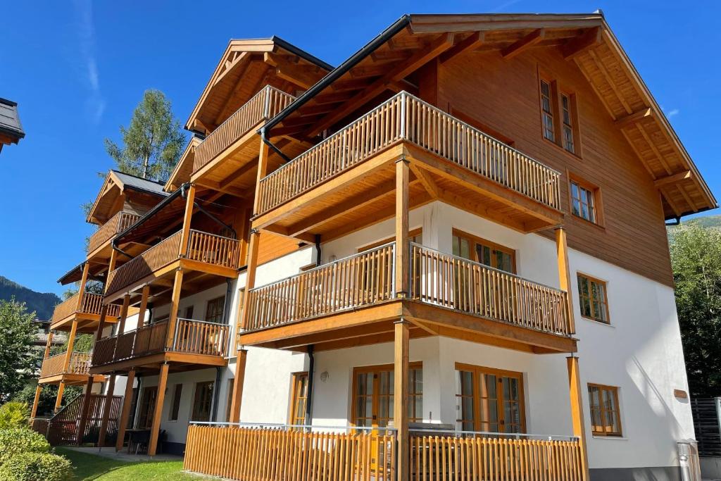 a large apartment building with balconies on it at Kerstin 5 by SMR Rauris Apartments - inc Spa and National Summercard - near Gondola in Rauris