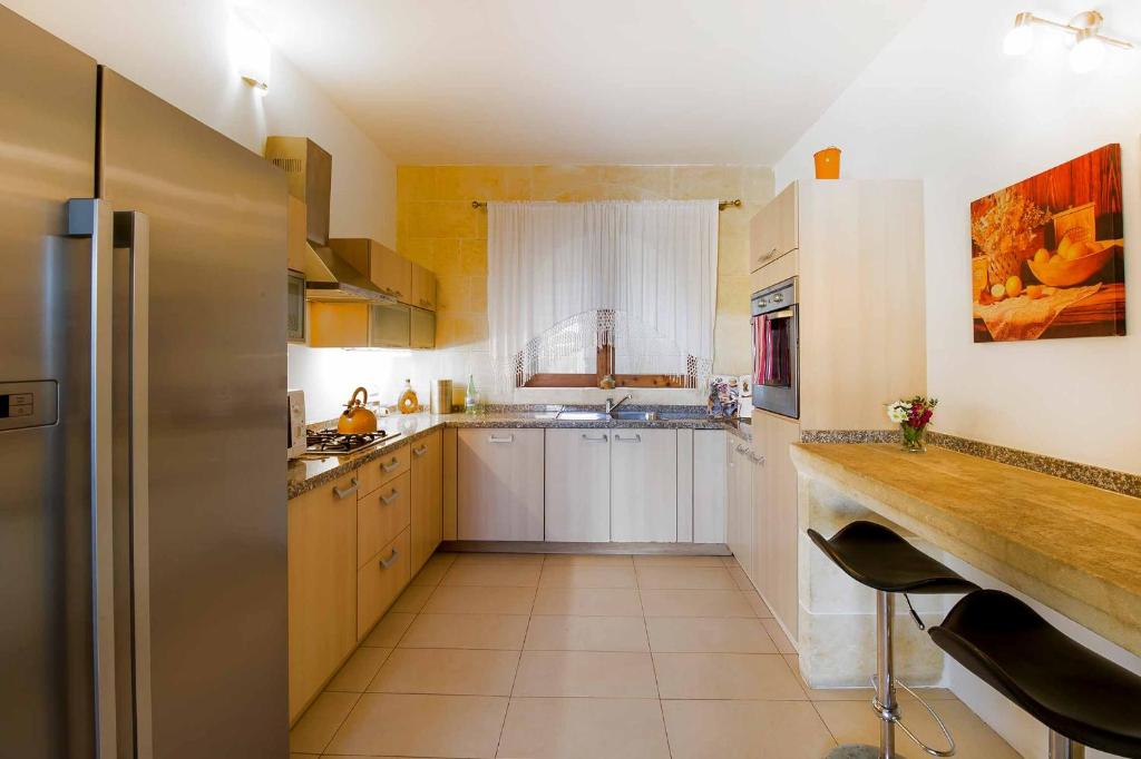 Kuchyň nebo kuchyňský kout v ubytování Four Winds Holiday Home