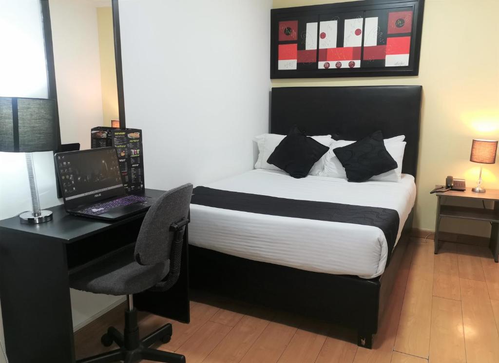 Postel nebo postele na pokoji v ubytování Hotel Radel Superior