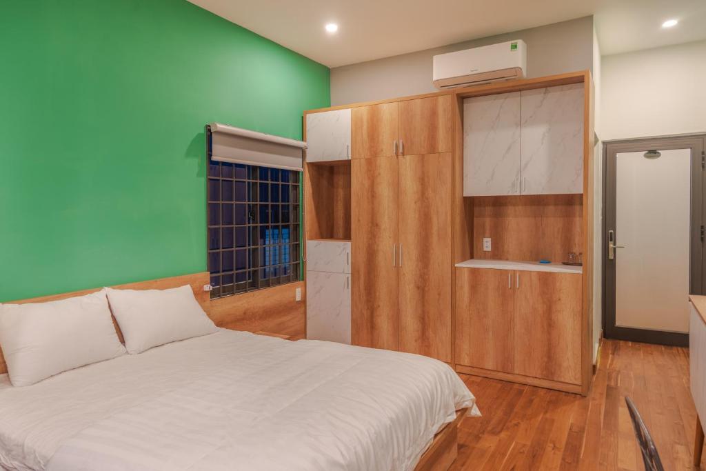 Postel nebo postele na pokoji v ubytování POTA Hotel & Apartment