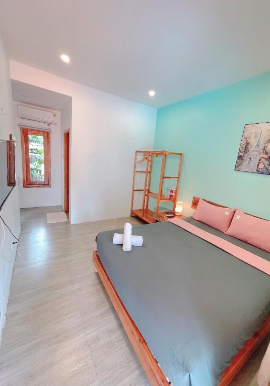 Giường trong phòng chung tại LANGCHIA HOME