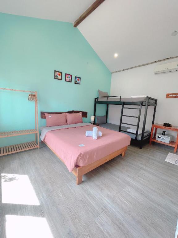 Giường trong phòng chung tại LANGCHIA HOME