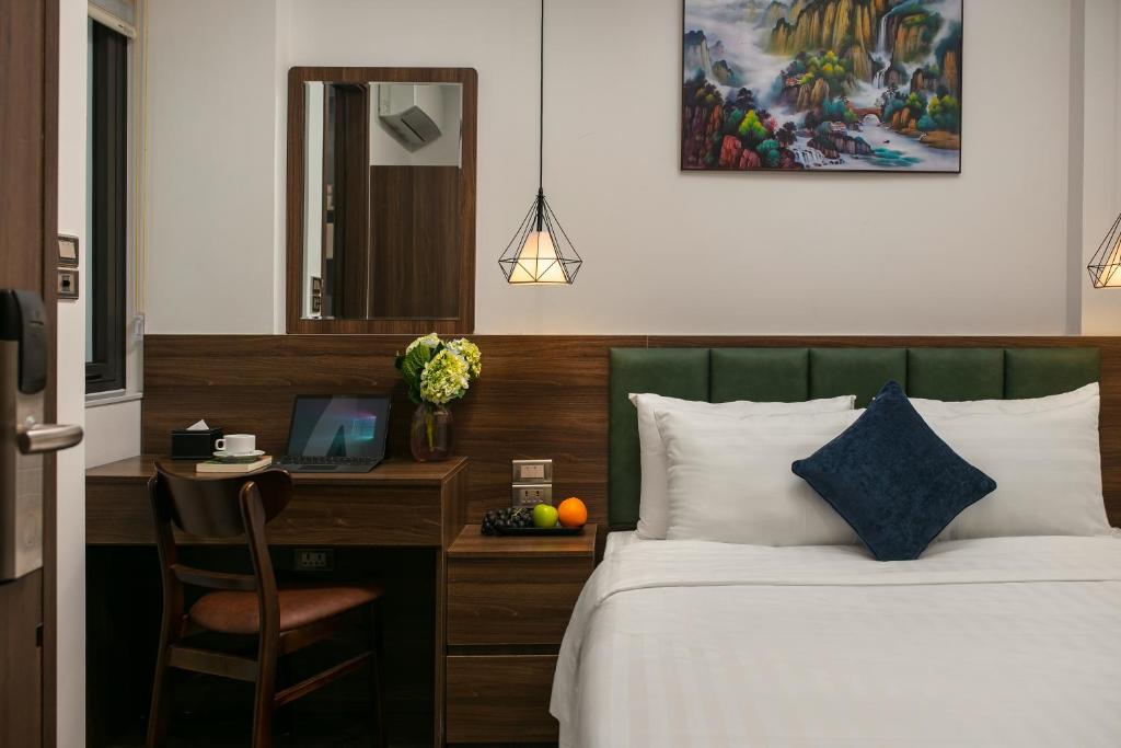 Postel nebo postele na pokoji v ubytování Hanoi Vacanza Premier Hotel