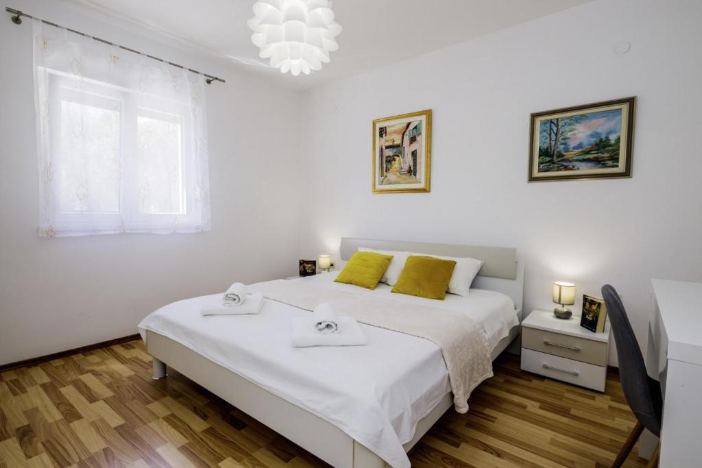 Postel nebo postele na pokoji v ubytování Ani in Trogir * Mittel-Dalmatien