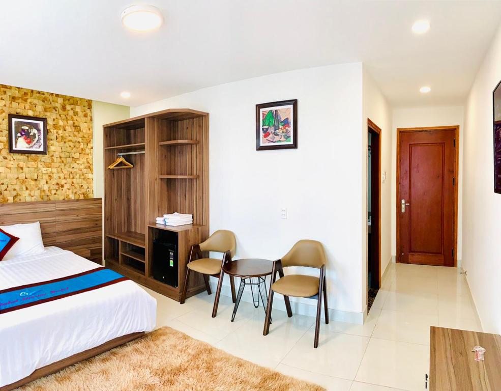 Postel nebo postele na pokoji v ubytování DALAT STREAM HOTEL-Khách sạn đẹp Đà Lạt