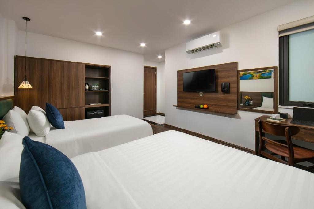 Postel nebo postele na pokoji v ubytování Hanoi Vacanza Premier Hotel