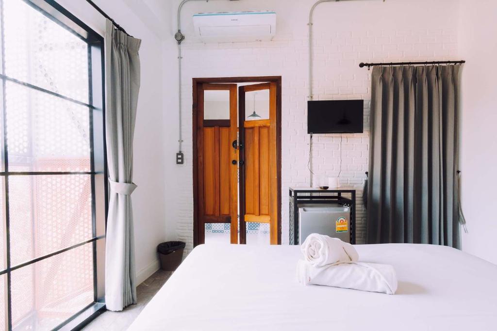 Postel nebo postele na pokoji v ubytování V1 Room Hotel