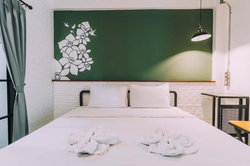 Postel nebo postele na pokoji v ubytování V1 Room Hotel