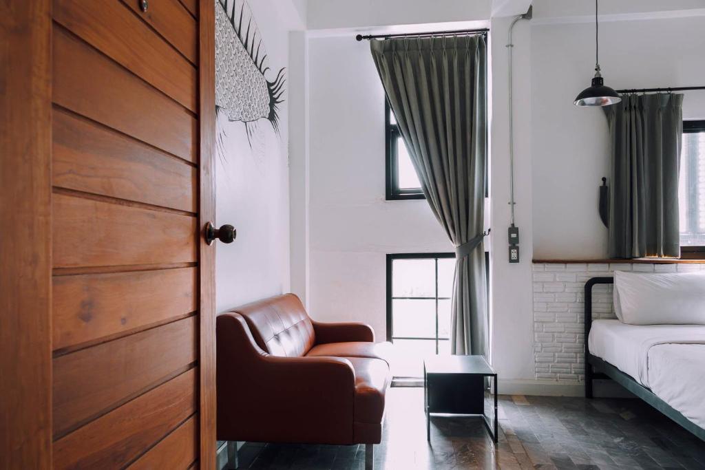 Postel nebo postele na pokoji v ubytování V1 Room Hotel