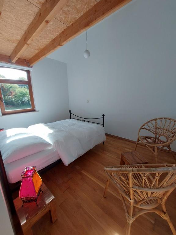 Postel nebo postele na pokoji v ubytování Le Gîte du Herdal