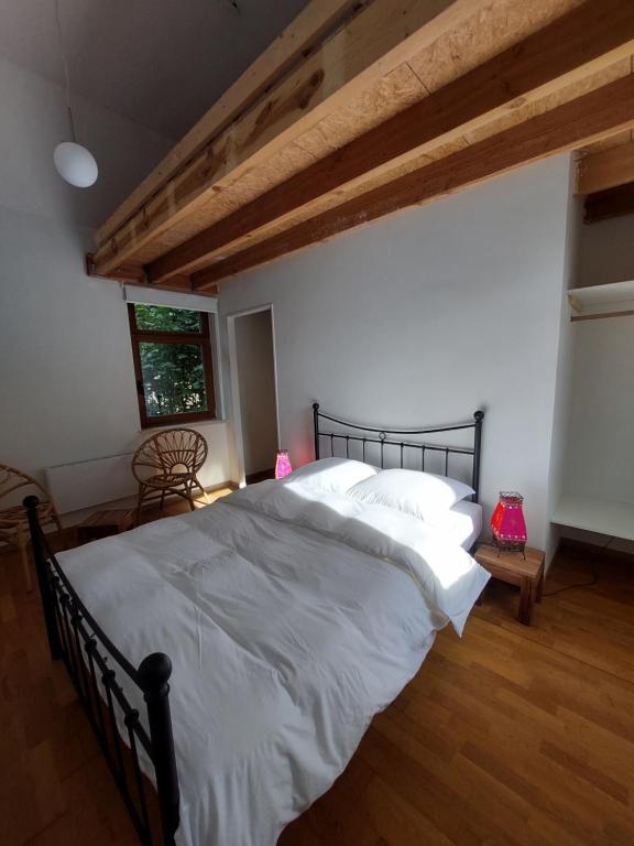 Postel nebo postele na pokoji v ubytování Le Gîte du Herdal