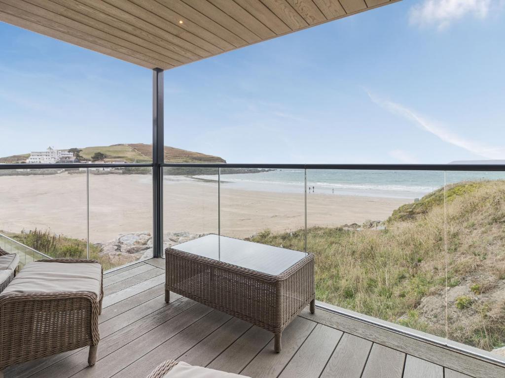 a view of the beach from the balcony of a house at Apartment 18, Burgh Island Causeway in Kingsbridge