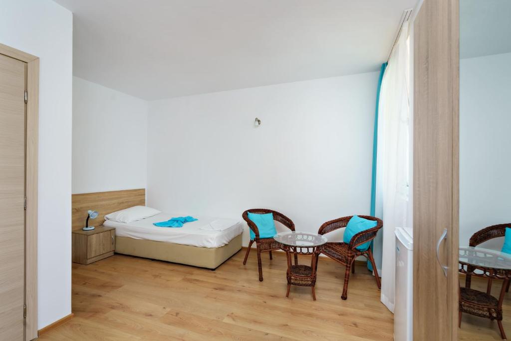 Postel nebo postele na pokoji v ubytování Hotel Elitza