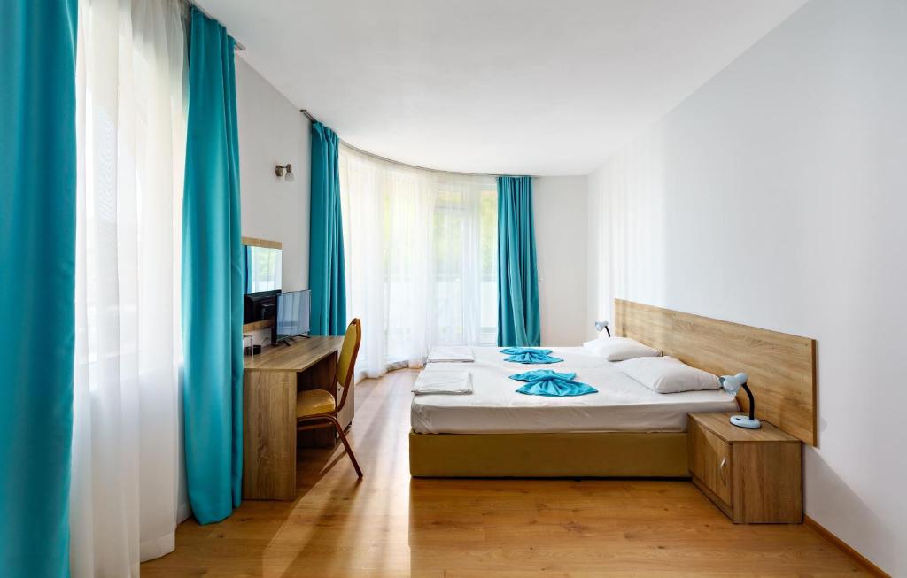 Postel nebo postele na pokoji v ubytování Hotel Elitza